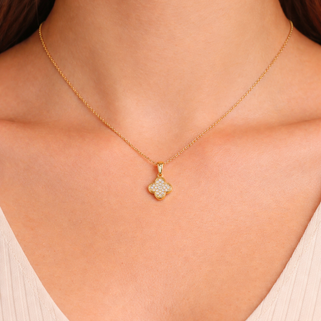 Diamond clover pendant necklace, close-up view